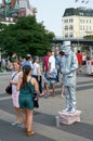 A old man animator in metallic silver costume. Hamburg