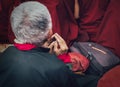 Old man buddhist monk`s hands in prayer gesture Royalty Free Stock Photo