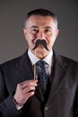 Old man with carton moustaches Royalty Free Stock Photo