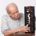 Old man and chinese abacus