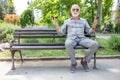 Old man compare two smartphones Royalty Free Stock Photo