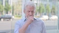 Old Man Coughing while Standing Outdoor Royalty Free Stock Photo