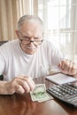 old man counts the money. Financial problems. Beggary and pensioner poverty. Problems during lockdown and crisis Royalty Free Stock Photo