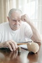 old man counts the money. Financial problems. Beggary and pensioner poverty. Problems during lockdown and crisis Royalty Free Stock Photo