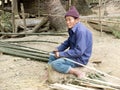 Old man cutting bamboo.