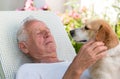 Old man with dog in garden Royalty Free Stock Photo