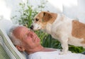 Old man with dog in garden Royalty Free Stock Photo