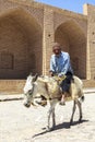 Old Man donkey riding in Kharanagh Village, Iran Royalty Free Stock Photo