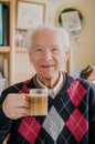 Old man drinking coffee at home Royalty Free Stock Photo