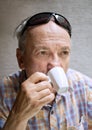Old man drinking cup of coffee Royalty Free Stock Photo