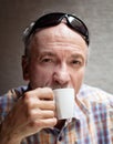 Old man drinking cup of coffee Royalty Free Stock Photo
