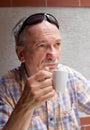 Old man drinking cup of coffee Royalty Free Stock Photo