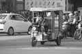 Old man drives tuk tuk car in India