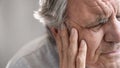 Old man with ear pain Royalty Free Stock Photo