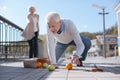 Old man falling down in the street