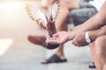 Old man feeding the pigeon in the street. Royalty Free Stock Photo