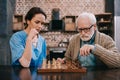 Old man and female caregiver Royalty Free Stock Photo