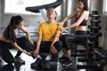 Old man get massage by women at fitness gym