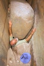 Old man gets stuck between rocks