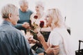 Old Man Giving Rose to Woman in Waiting Room.