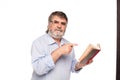 Old man with glasses reading a book Royalty Free Stock Photo