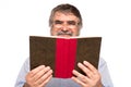 Old man with glasses reading a book Royalty Free Stock Photo