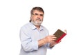 Old man with glasses reading a book Royalty Free Stock Photo