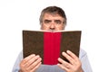 Old man with glasses reading a book Royalty Free Stock Photo