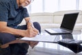 Old man in glasses writing the insurance paper Royalty Free Stock Photo