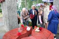 Old man grandfather veteran of World War II in medals and decorations puts cents Victory Day Moscow, Russia, 05.09.2018