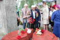 Old man grandfather veteran of World War II in medals and decorations puts cents Victory Day Moscow, Russia, 05.09.2018