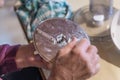 Old man grandpa with hands builds assembled disassembles a kitchen mashine into the parts, Germany