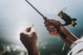 Old Man with Gray Hair Fishing on River in Summer.