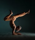 Old man with grey beard doing yoga, pilates, fitness training, stretching exercise, asana or balance workout on floor Royalty Free Stock Photo