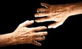 Old man hand isolated on black background Royalty Free Stock Photo