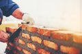 Old man Hand white-wash cement built wall brick new house, Brick Royalty Free Stock Photo