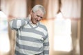 Old man has neck pain. Royalty Free Stock Photo