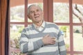 Old man having chest pain.