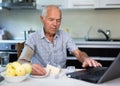 Old man having online medical consultation through internet Royalty Free Stock Photo