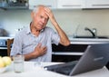 Old man having online medical consultation through internet Royalty Free Stock Photo