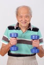 Old man healthy exercise hold dumbbell Royalty Free Stock Photo