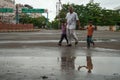 An old man with his grand children on road