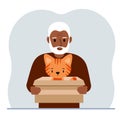 A old man is holding a cardboard box with a beautiful ginger cat. The concept of rescue, help and care for pets.