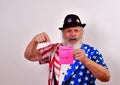 Old man holding up a vote memo