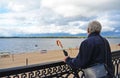 Old man holding vintage umbrella looking far Royalty Free Stock Photo