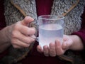 An old man holds an aspirin in his hands. Royalty Free Stock Photo