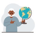 A old man holds a globe in his hand and points his finger at it. The concept of education, teacher, world conquest