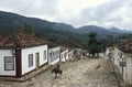 Old man on a horse along an unspoiled colonial street in Tiradentes, Brazil.