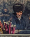 Old man and Incense sticks Xining, Qinghai, China