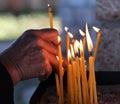 Old man lights a candle Royalty Free Stock Photo